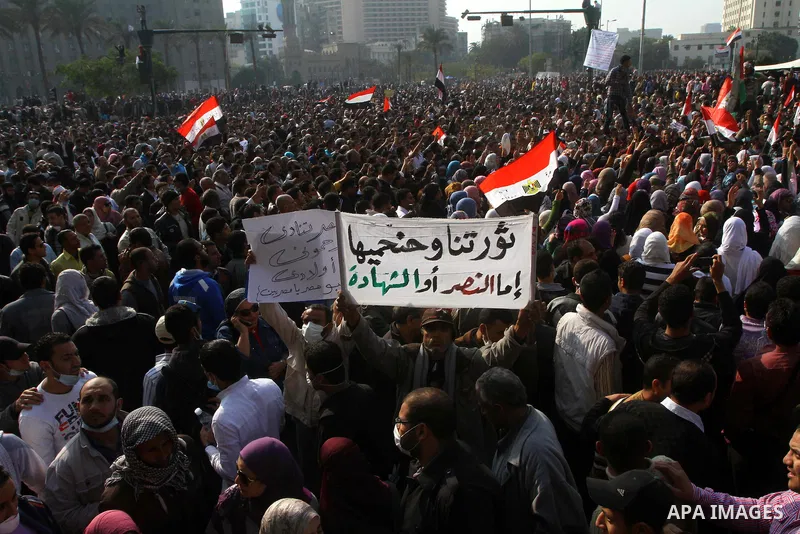 Thousands of Egyptian protesters attend a rally in Tahrir Square on the fourth day of clashes between protesters and riot police in the capital Cairo, on November 22, 2011, as they demand an end to military rule, heighte...