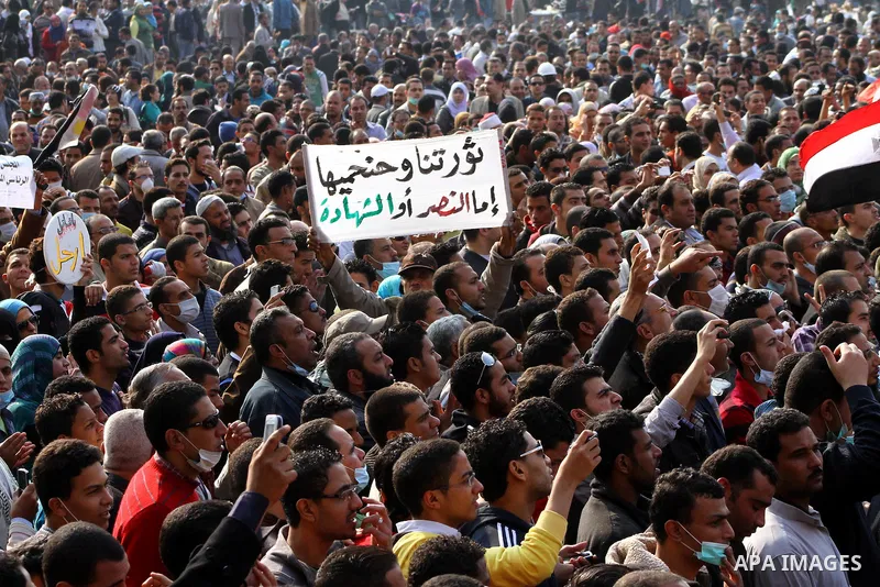 Thousands of Egyptian protesters attend a rally in Tahrir Square on the fourth day of clashes between protesters and riot police in the capital Cairo, on November 22, 2011, as they demand an end to military rule, heighte...