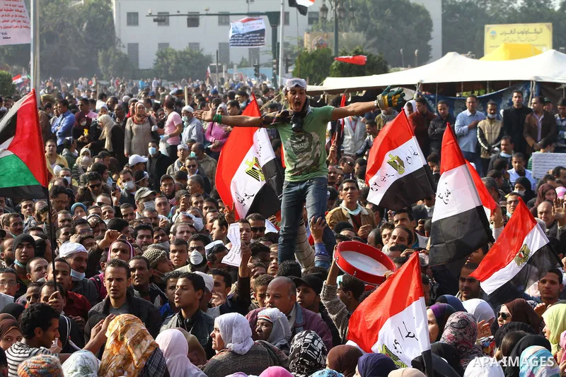 Thousands of Egyptian protesters attend a rally in Tahrir Square on the fourth day of clashes between protesters and riot police in the capital Cairo, on November 22, 2011, as they demand an end to military rule, heighte...