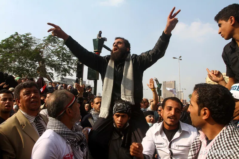 Thousands of Egyptian protesters attend a rally in Tahrir Square on the fourth day of clashes between protesters and riot police in the capital Cairo, on November 22, 2011, as they demand an end to military rule, heighte...