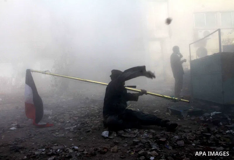 Egyptian protestors clash with riot police, not pictured, near Tahrir square in Cairo, Egypt, Wednesday, Nov. 23, 2011. Egyptian police are clashing with anti-government protesters for a fifth day in Cairo. Tens of thous...