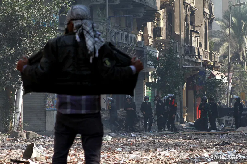 Egyptian riot police clash with protestors near Tahrir square in Cairo, Egypt, Wednesday, Nov. 23, 2011. Egyptian police are clashing with anti-government protesters for a fifth day in Cairo. Tens of thousands of protest...