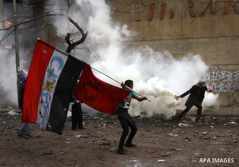 Egyptian protestors clash with riot police, not pictured, near Tahrir square in Cairo, Egypt, Wednesday, Nov. 23, 2011. Egyptian police are clashing with anti-government protesters for a fifth day in Cairo. Tens of thous...
