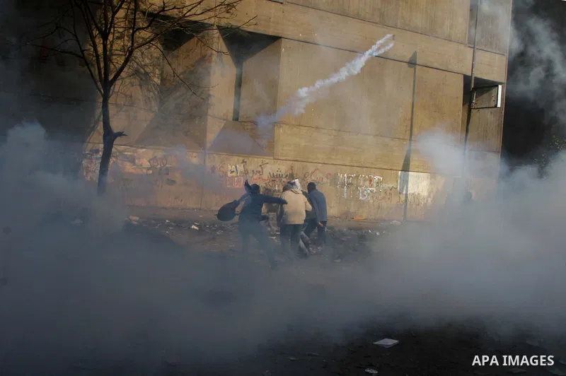 Egyptian protestors clash with riot police, not pictured, near Tahrir square in Cairo, Egypt, Wednesday, Nov. 23, 2011. Egyptian police are clashing with anti-government protesters for a fifth day in Cairo. Tens of thous...