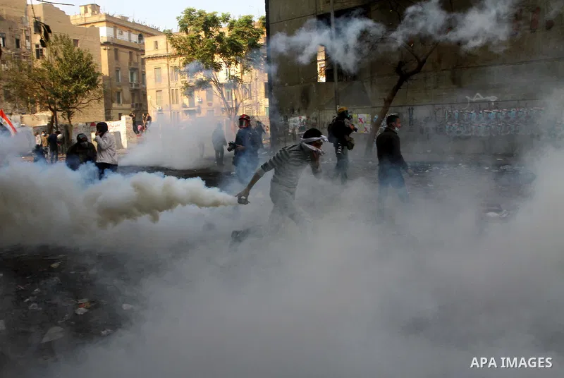Egyptian protestors clash with riot police, not pictured, near Tahrir square in Cairo, Egypt, Wednesday, Nov. 23, 2011. Egyptian police are clashing with anti-government protesters for a fifth day in Cairo. Tens of thous...