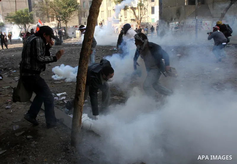 Egyptian protestors clash with riot police, not pictured, near Tahrir square in Cairo, Egypt, Wednesday, Nov. 23, 2011. Egyptian police are clashing with anti-government protesters for a fifth day in Cairo. Tens of thous...