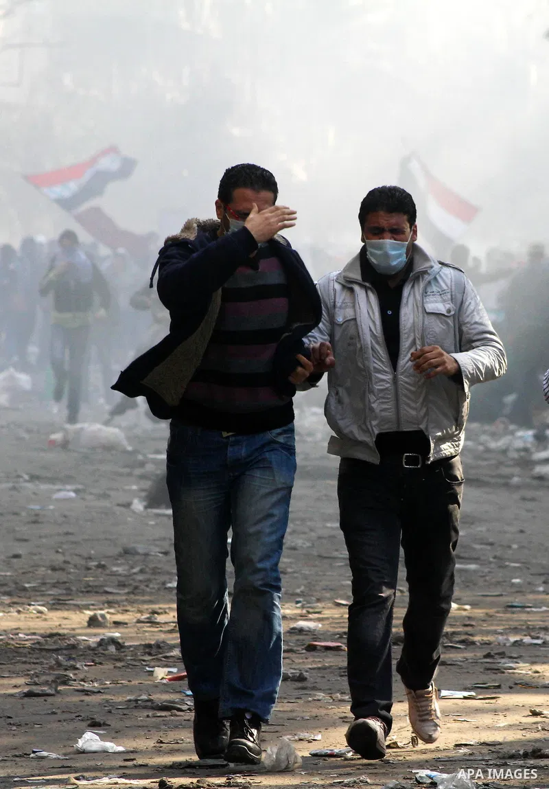 Egyptian protestors clash with riot police, not pictured, near Tahrir square in Cairo, Egypt, Wednesday, Nov. 23, 2011. Egyptian police are clashing with anti-government protesters for a fifth day in Cairo. Tens of thous...