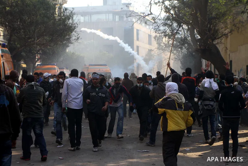 Egyptian protestors clash with riot police, not pictured, near Tahrir square in Cairo, Egypt, Wednesday, Nov. 23, 2011. Egyptian police are clashing with anti-government protesters for a fifth day in Cairo. Tens of thous...