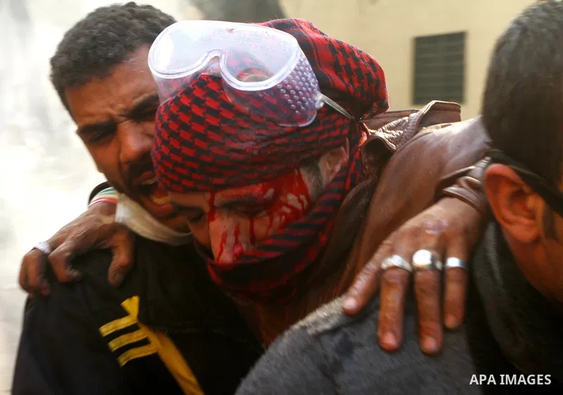 Egyptian protestors clash with riot police, not pictured, near Tahrir square in Cairo, Egypt, Wednesday, Nov. 23, 2011. Egyptian police are clashing with anti-government protesters for a fifth day in Cairo. Tens of thous...