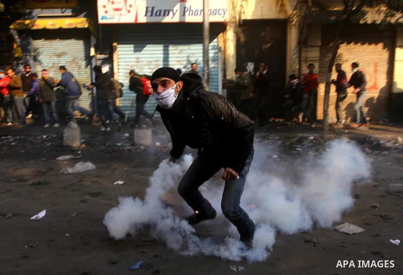 Egyptian protestors clash with riot police, not pictured, near Tahrir square in Cairo, Egypt, Wednesday, Nov. 23, 2011. Egyptian police are clashing with anti-government protesters for a fifth day in Cairo. Tens of thous...
