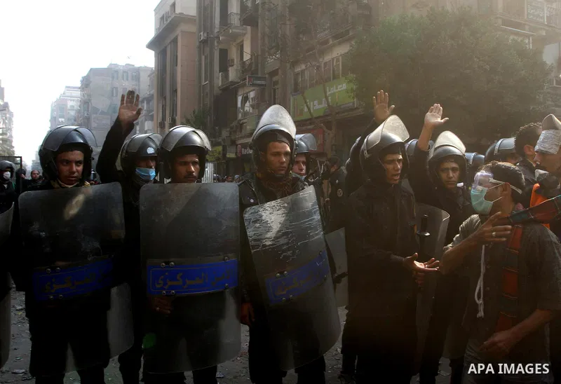 Egyptian riot police clash with protestors near Tahrir square in Cairo, Egypt, Wednesday, Nov. 23, 2011. Egyptian police are clashing with anti-government protesters for a fifth day in Cairo. Tens of thousands of protest...