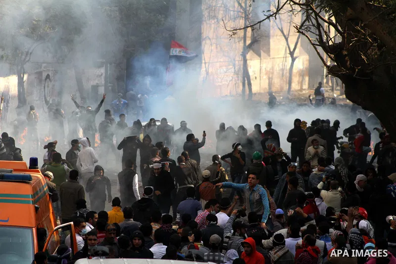 Egyptian protestors clash with riot police, not pictured, near Tahrir square in Cairo, Egypt, Wednesday, Nov. 23, 2011. Egyptian police are clashing with anti-government protesters for a fifth day in Cairo. Tens of thous...