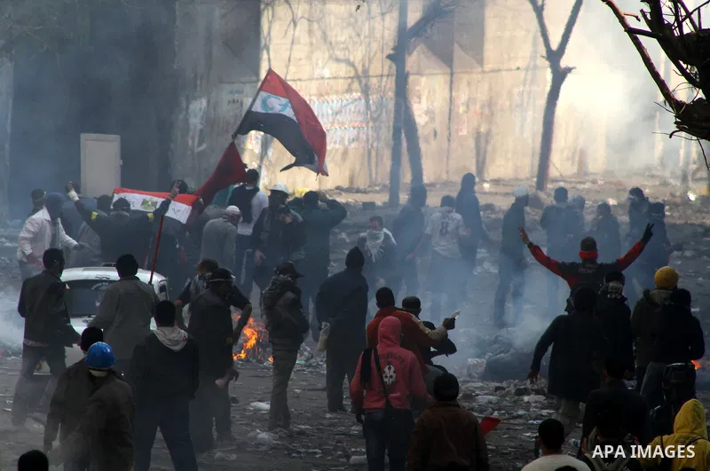 Egyptian protestors clash with riot police, not pictured, near Tahrir square in Cairo, Egypt, Wednesday, Nov. 23, 2011. Egyptian police are clashing with anti-government protesters for a fifth day in Cairo. Tens of thous...
