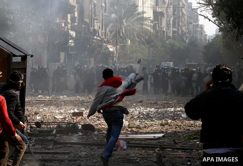 Egyptian riot police clash with protestors near Tahrir square in Cairo, Egypt, Wednesday, Nov. 23, 2011. Egyptian police are clashing with anti-government protesters for a fifth day in Cairo. Tens of thousands of protest...