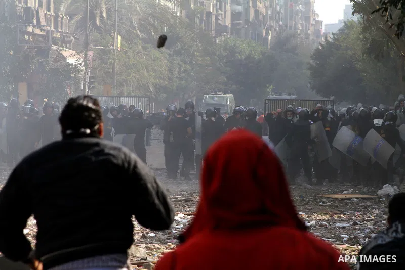 Egyptian riot police clash with protestors near Tahrir square in Cairo, Egypt, Wednesday, Nov. 23, 2011. Egyptian police are clashing with anti-government protesters for a fifth day in Cairo. Tens of thousands of protest...
