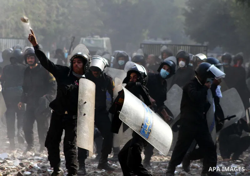 Egyptian riot police clash with protestors near Tahrir square in Cairo, Egypt, Wednesday, Nov. 23, 2011. Egyptian police are clashing with anti-government protesters for a fifth day in Cairo. Tens of thousands of protest...