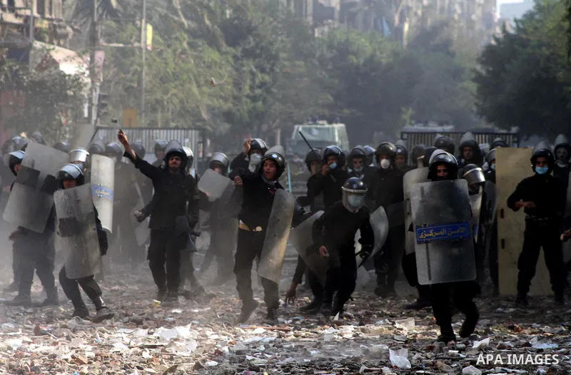 Egyptian riot police clash with protestors near Tahrir square in Cairo, Egypt, Wednesday, Nov. 23, 2011. Egyptian police are clashing with anti-government protesters for a fifth day in Cairo. Tens of thousands of protest...