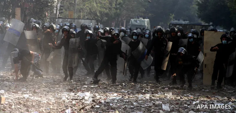 Egyptian riot police clash with protestors near Tahrir square in Cairo, Egypt, Wednesday, Nov. 23, 2011. Egyptian police are clashing with anti-government protesters for a fifth day in Cairo. Tens of thousands of protest...