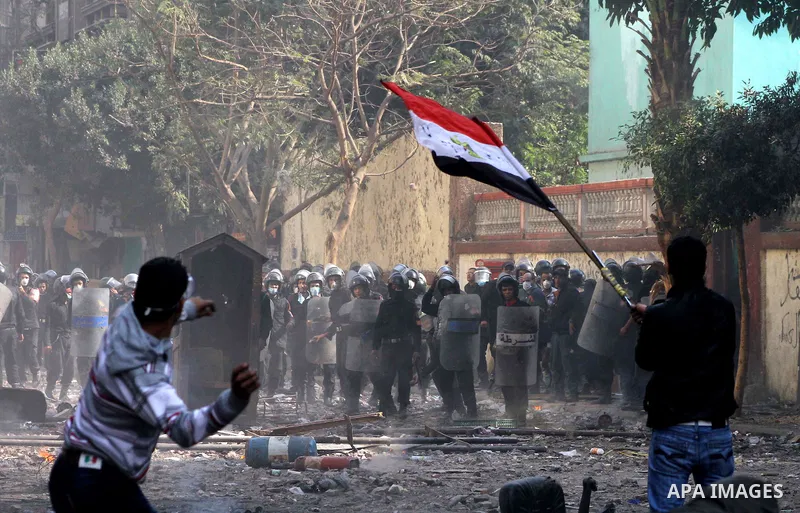 Egyptian riot police clash with protestors near Tahrir square in Cairo, Egypt, Wednesday, Nov. 23, 2011. Egyptian police are clashing with anti-government protesters for a fifth day in Cairo. Tens of thousands of protest...