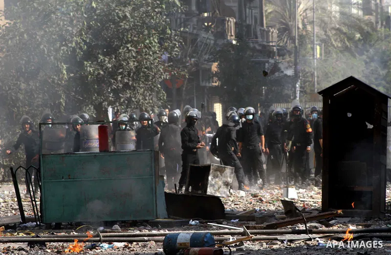 Egyptian riot police clash with protestors near Tahrir square in Cairo, Egypt, Wednesday, Nov. 23, 2011. Egyptian police are clashing with anti-government protesters for a fifth day in Cairo. Tens of thousands of protest...