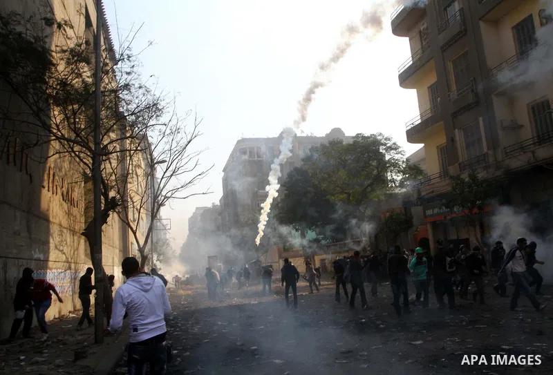 Egyptian protestors clash with riot police, not pictured, near Tahrir square in Cairo, Egypt, Wednesday, Nov. 23, 2011. Egyptian police are clashing with anti-government protesters for a fifth day in Cairo. Tens of thous...