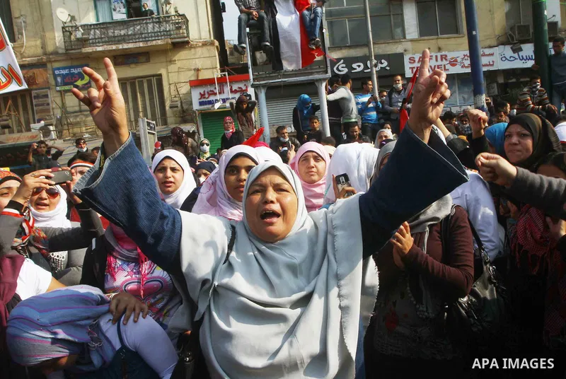 Protesters gather on Tahrir square as clashes against the anti-riot police are underway nearby in the street leading to the ministry of interior in Cairo, Egypt, Wednesday, Nov. 23, 2011. Tens of thousands of protesters...