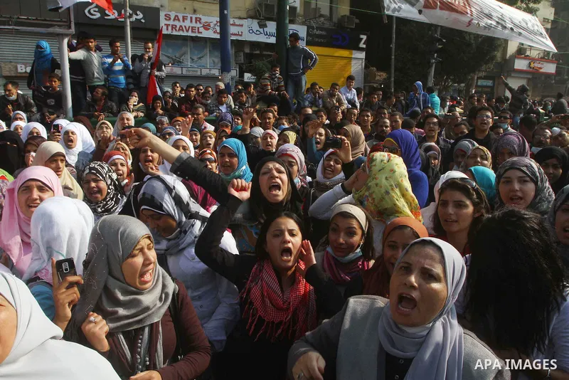Protesters gather on Tahrir square as clashes against the anti-riot police are underway nearby in the street leading to the ministry of interior in Cairo, Egypt, Wednesday, Nov. 23, 2011. Tens of thousands of protesters...