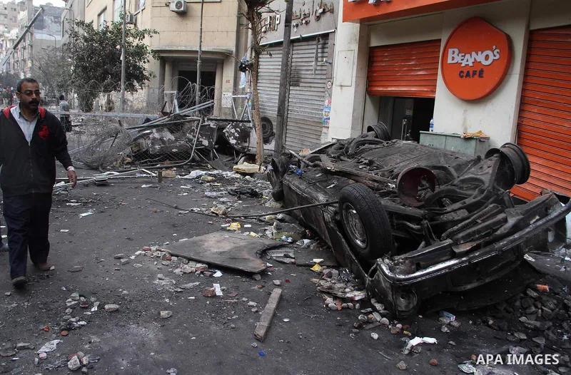 Egyptian protesters gather near barbed wire and concrete barricades around the Interior Ministry, near Cairo's Tahrir Square, November 24, 2011. A truce between Egyptian riot police and protesters succeeded on Thursday i...