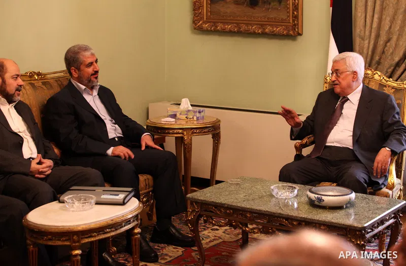 Palestinian president Mahmud Abbas meets with Hamas chief Khaled Meshaal and other top Fatah and Hamas officials in Cairo on November 24, 2011. Abbas and Meshaal hailed a new Palestinian "partnership" after talks to impl...