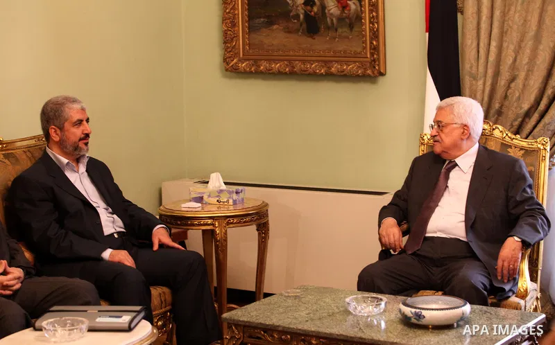 Palestinian president Mahmud Abbas meets with Hamas chief Khaled Meshaal and other top Fatah and Hamas officials in Cairo on November 24, 2011. Abbas and Meshaal hailed a new Palestinian "partnership" after talks to impl...