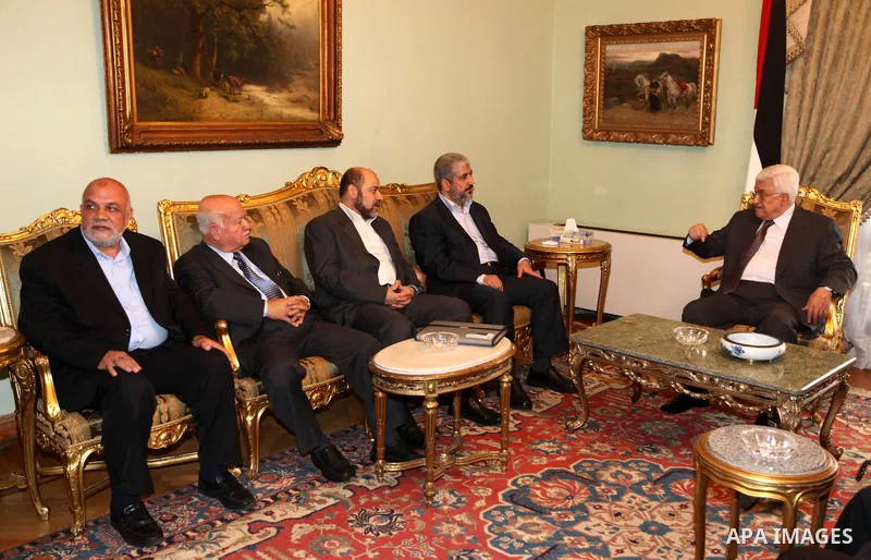 Palestinian president Mahmud Abbas meets with Hamas chief Khaled Meshaal and other top Fatah and Hamas officials in Cairo on November 24, 2011. Abbas and Meshaal hailed a new Palestinian "partnership" after talks to impl...