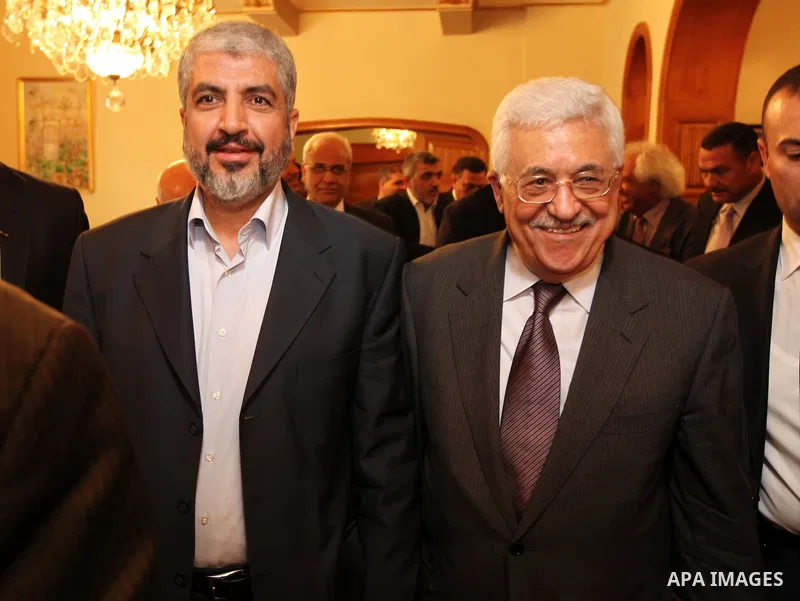 Palestinian president Mahmud Abbas meets with Hamas chief Khaled Meshaal and other top Fatah and Hamas officials in Cairo on November 24, 2011. Abbas and Meshaal hailed a new Palestinian "partnership" after talks to impl...