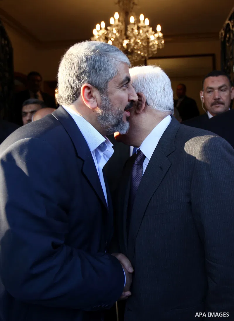 Palestinian president Mahmud Abbas meets with Hamas chief Khaled Meshaal and other top Fatah and Hamas officials in Cairo on November 24, 2011. Abbas and Meshaal hailed a new Palestinian "partnership" after talks to impl...