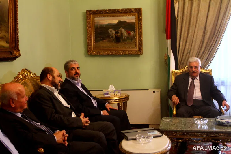 Palestinian president Mahmud Abbas speaks during a meeting with Hamas chief Khaled Meshaal and other top Fatah and Hamas officials in Cairo on November 24, 2011. Abbas and Meshaal hailed a new Palestinian "partnership" a...