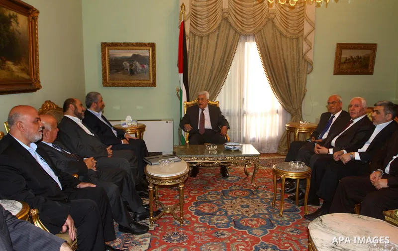 Palestinian president Mahmud Abbas speaks during a meeting with Hamas chief Khaled Meshaal and other top Fatah and Hamas officials in Cairo on November 24, 2011. Abbas and Meshaal hailed a new Palestinian "partnership" a...