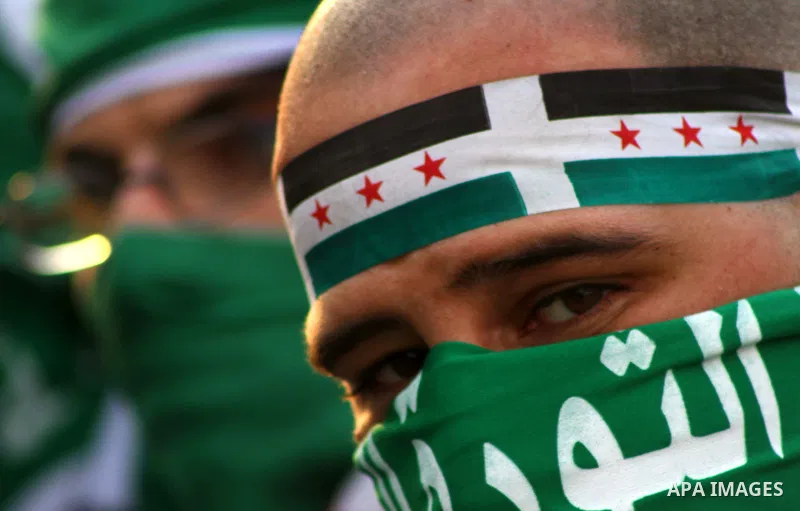 Pro-reform supporters protest outside the Arab League headquarters in the Egyptian capital Cairo, where a ministerial meeting on Syria was held on November 24, 2011. Arab foreign ministers have invited Syria to sign an a...