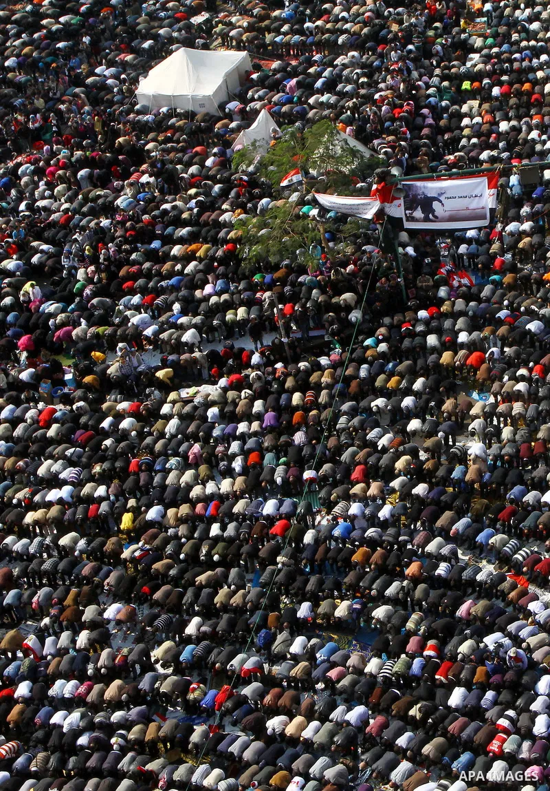 Egyptian protesters pray during a mass rally in Cairo's landmark Tahrir square on November 25, 2011 to demand an end to the military rule. The head of the military council tasked 79-year-old Kamal al-Ganzuri, who was pre...