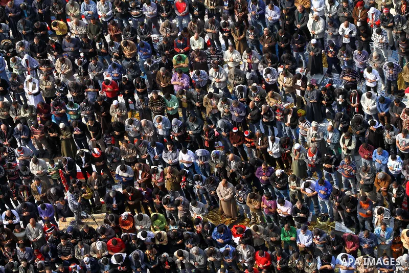 Egyptian protesters pray during a mass rally in Cairo's landmark Tahrir square on November 25, 2011 to demand an end to the military rule. The head of the military council tasked 79-year-old Kamal al-Ganzuri, who was pre...
