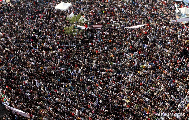 Egyptian protesters pray during a mass rally in Cairo's landmark Tahrir square on November 25, 2011 to demand an end to the military rule. The head of the military council tasked 79-year-old Kamal al-Ganzuri, who was pre...