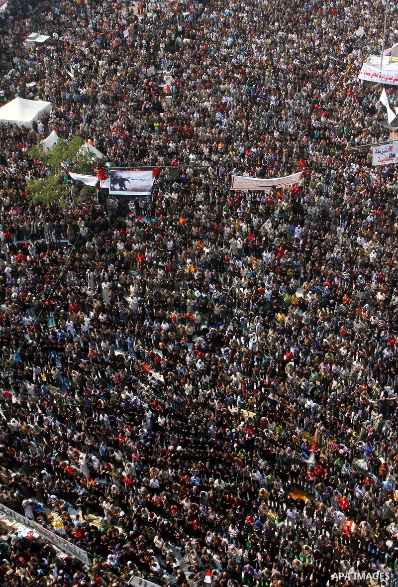 Egyptian protesters pray during a mass rally in Cairo's landmark Tahrir square on November 25, 2011 to demand an end to the military rule. The head of the military council tasked 79-year-old Kamal al-Ganzuri, who was pre...