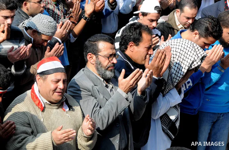 Egyptian protesters pray during a mass rally in Cairo's landmark Tahrir square on November 25, 2011 to demand an end to the military rule. The head of the military council tasked 79-year-old Kamal al-Ganzuri, who was pre...