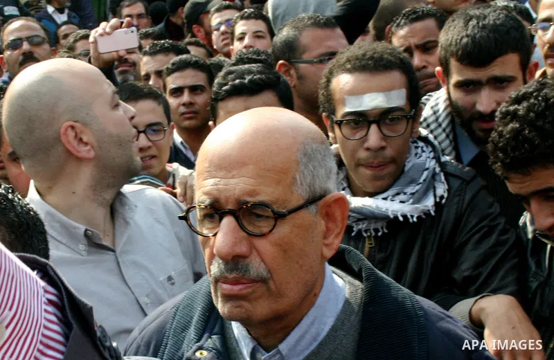 Pro-reform leader and Nobel peace laureate Mohamed El-Baradei is surrounded by protesters during his arrival for Friday prayers in Tahrir Square in Cairo, Egypt, 25 November 2011. The head of the military council tasked...