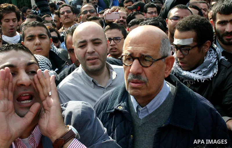 Pro-reform leader and Nobel peace laureate Mohamed El-Baradei is surrounded by protesters during his arrival for Friday prayers in Tahrir Square in Cairo, Egypt, 25 November 2011. The head of the military council tasked...