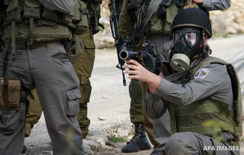 Israeli soldiers clash with Palestinian protesters during a protest near Kufr Qaddum, near the northern West Bank Jewish settlement of Kdumim Friday, Nov. 25, 2011. The protest was held against the closure of a main road...