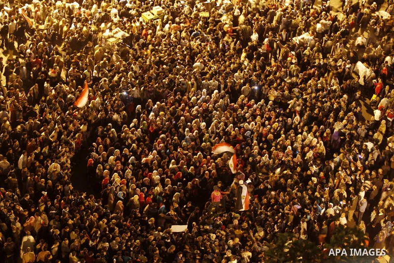 Thousands of Egyptian protesters attend a mass protest in Cairo's Tahrir square on November 24, 2011, as members of Egypt's ruling military council rejected calls to step down immediately, saying it would amount to a "be...