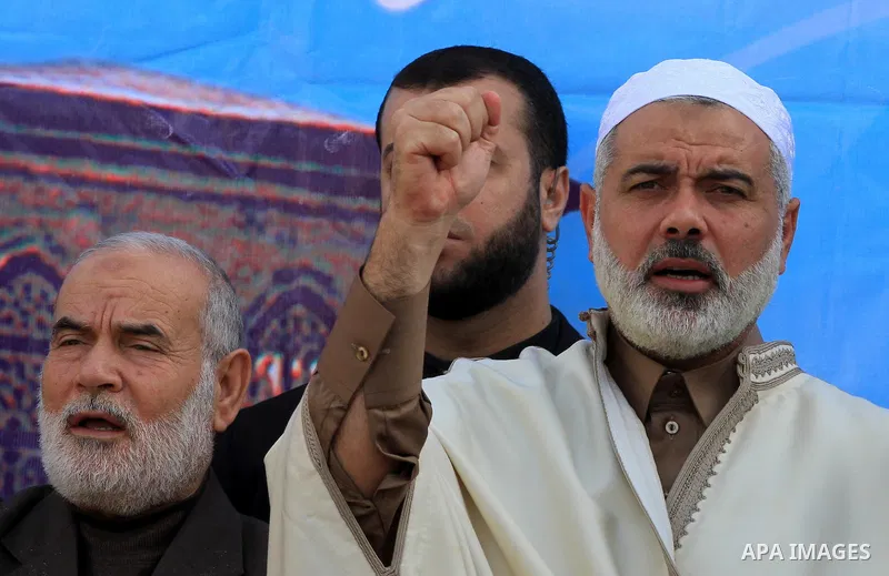 Palestinian prime minister in Gaza Strip, Ismail Haniya joins supporters in a rally in Gaza City to show their solidarity for Al-Aqsa mosque in Jerusalem November 25, 2011. The mosque built on the compound known to Musli...
