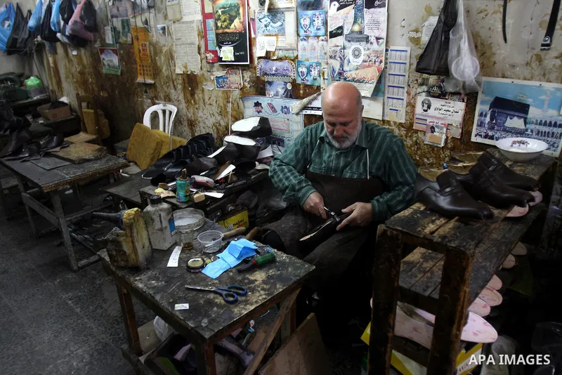 A Palestinian workers shoes in a shoe factory in the Old City of Nablus. Palestinian National Authority encourages Products Palestinian in the West Bank, Nov. 26, 2011. Photo by Wagdi Eshtayah