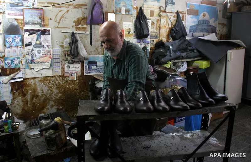 A Palestinian workers shoes in a shoe factory in the Old City of Nablus. Palestinian National Authority encourages Products Palestinian in the West Bank, Nov. 26, 2011. Photo by Wagdi Eshtayah