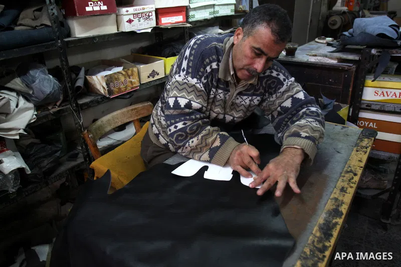 A Palestinian workers shoes in a shoe factory in the Old City of Nablus. Palestinian National Authority encourages Products Palestinian in the West Bank, Nov. 26, 2011. Photo by Wagdi Eshtayah
