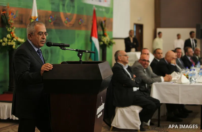 Palestinian Prime Minister Salam Fayyad participate in the opening of the Expotech gallery of information technology in the West Bank of Ramallah, on Nov. 27, 2011. Photo by Mustafa Abu Dayeh